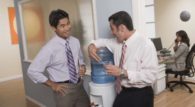 Men at water cooler Men at water cooler
